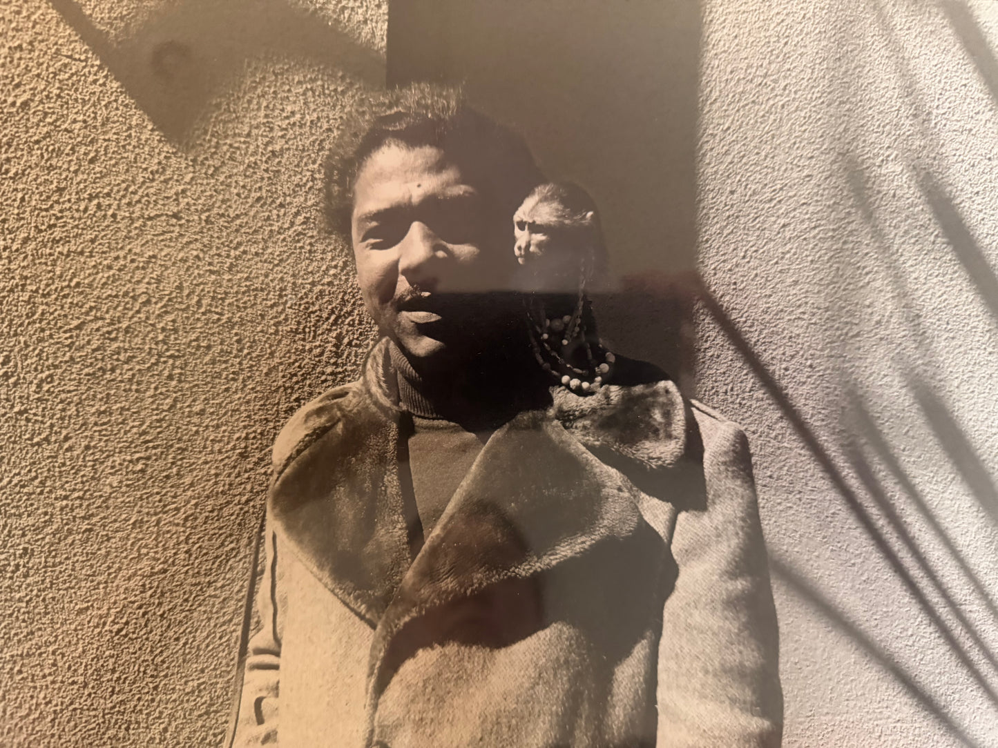 Man with Monkey Photograph by Julia Nead, signed and dated 1976