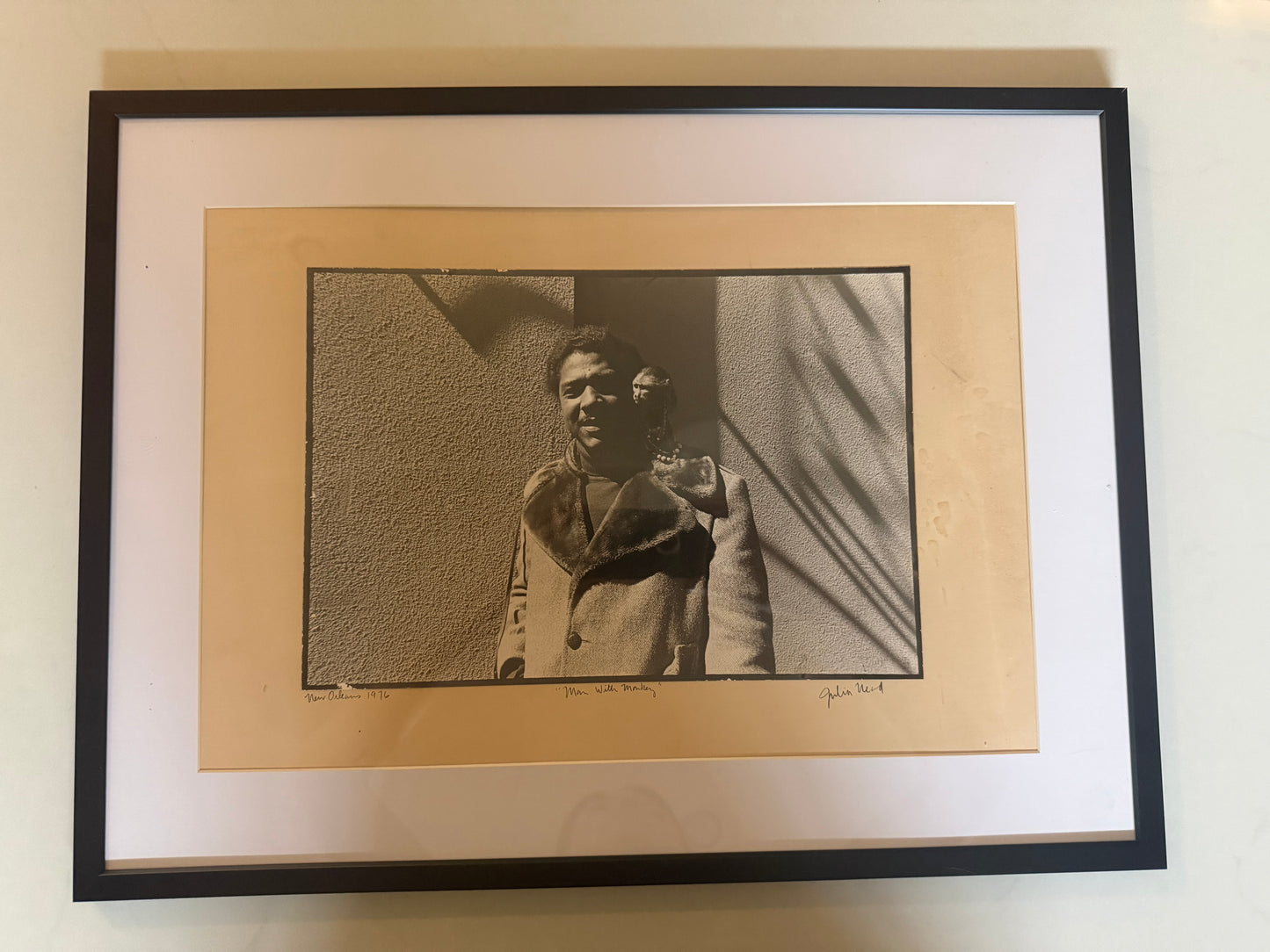 Man with Monkey Photograph by Julia Nead, signed and dated 1976