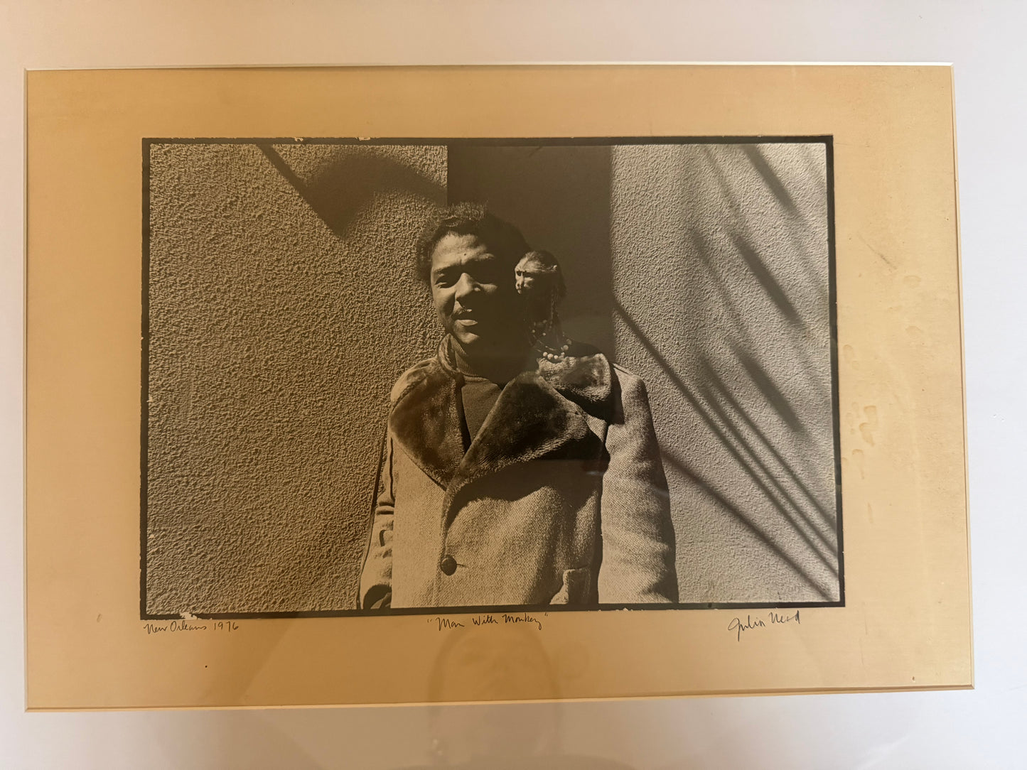 Man with Monkey Photograph by Julia Nead, signed and dated 1976