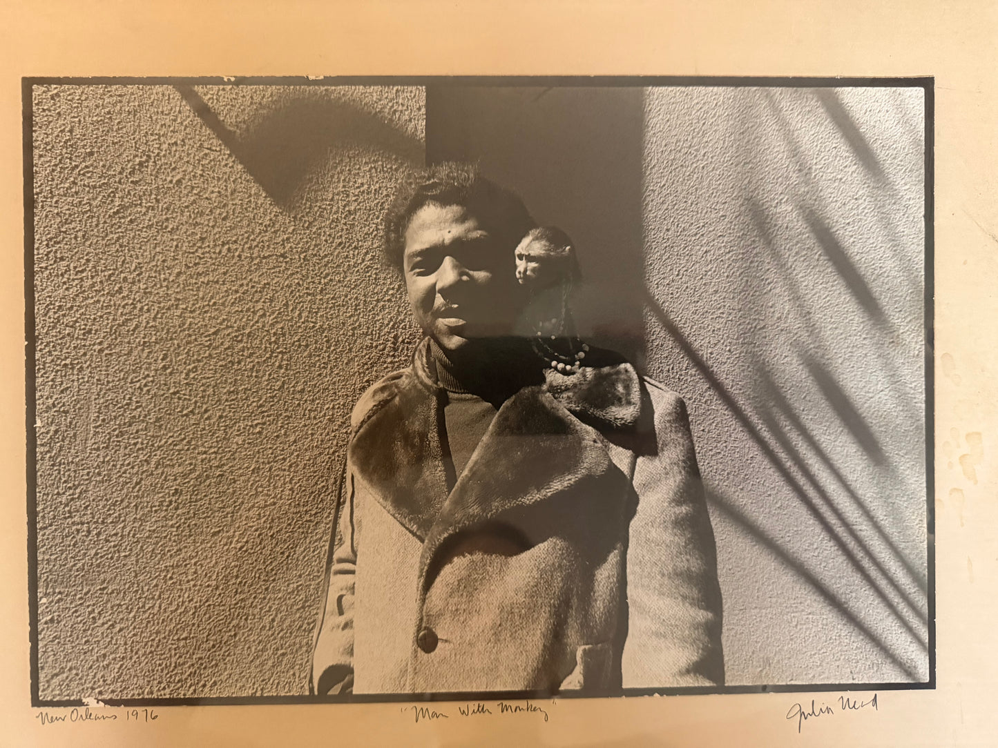 Man with Monkey Photograph by Julia Nead, signed and dated 1976